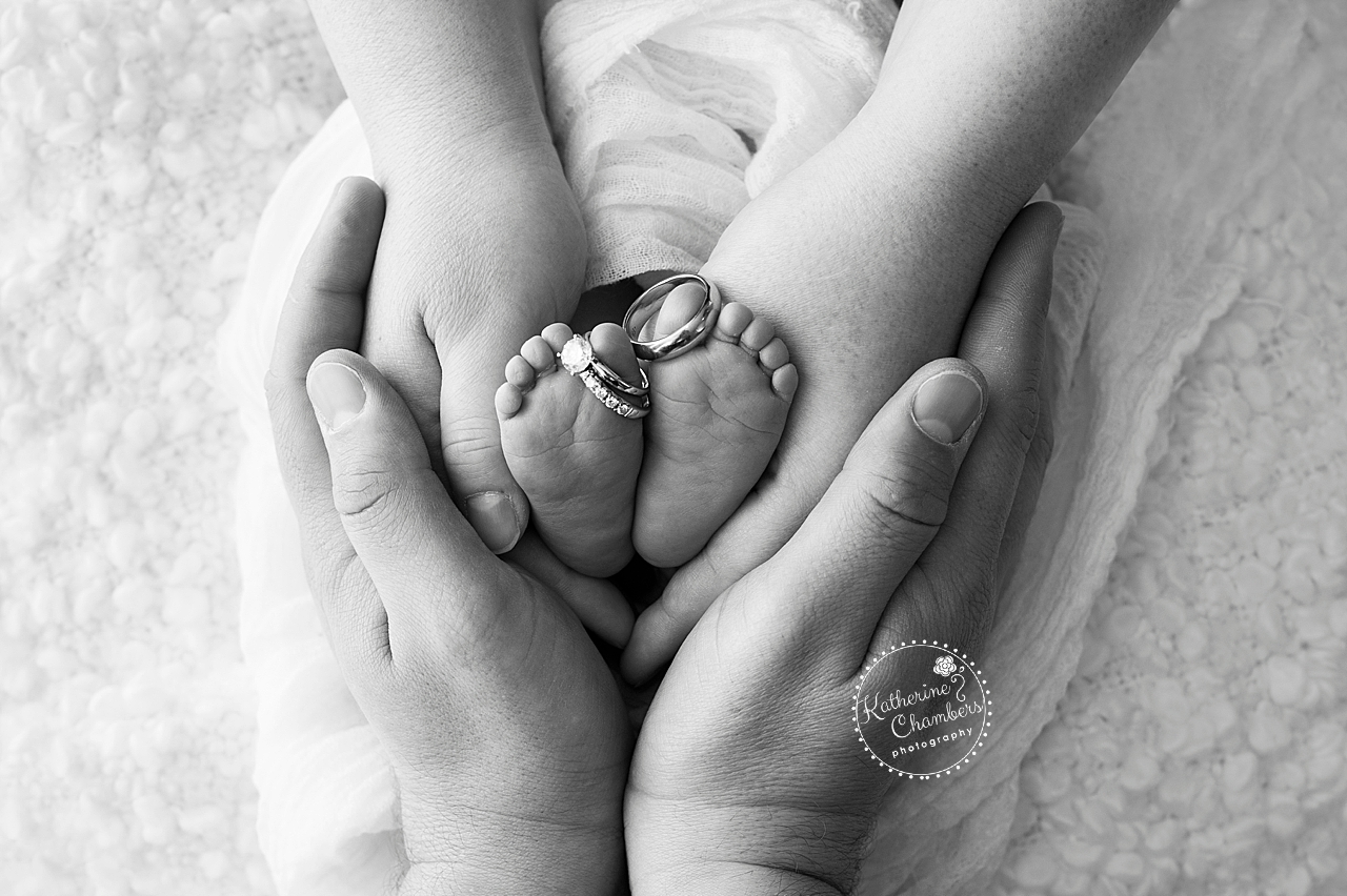 Newborn feet with Parents Hands